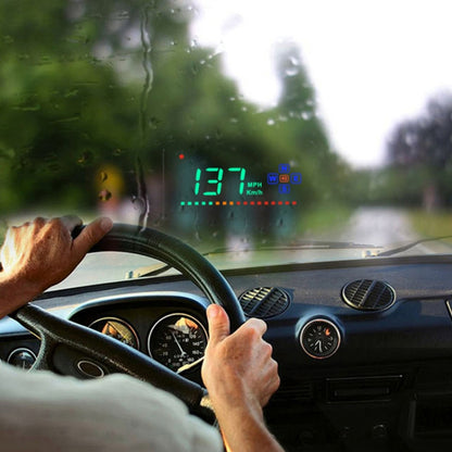 Car GPS head-up display projecting green speed and driver icons on windshield