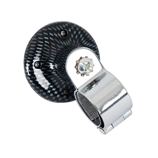 Steering wheel spinner knob with carbon-look disc, chrome mount, and visible mounting screws
