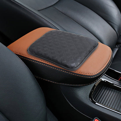 Black padded car armrest cover mat with tan trim and textured top surface