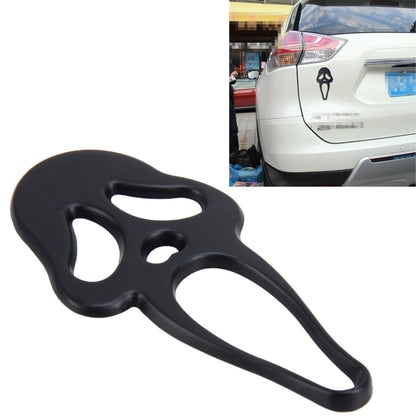 Black elf-shaped metal car sticker with face cutout design