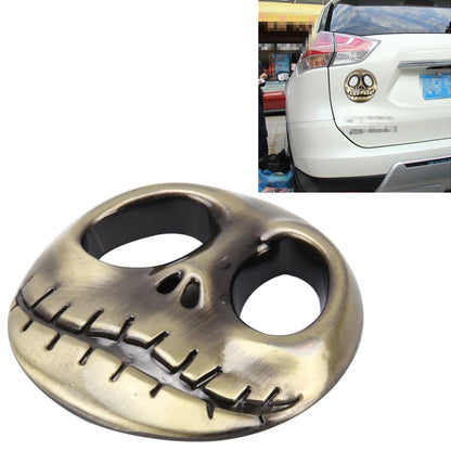 3D metal skull auto sticker with open eye holes and tooth row, gold finish