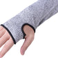 Grey elbow sleeve with black elastic cuff holding on securely on a hand.