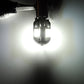 BA9S LED bulb glowing bright white, two yellow SMD chips visible inside the lens