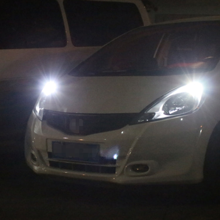 Car front showing bright white LED bulb glow near the headlight area