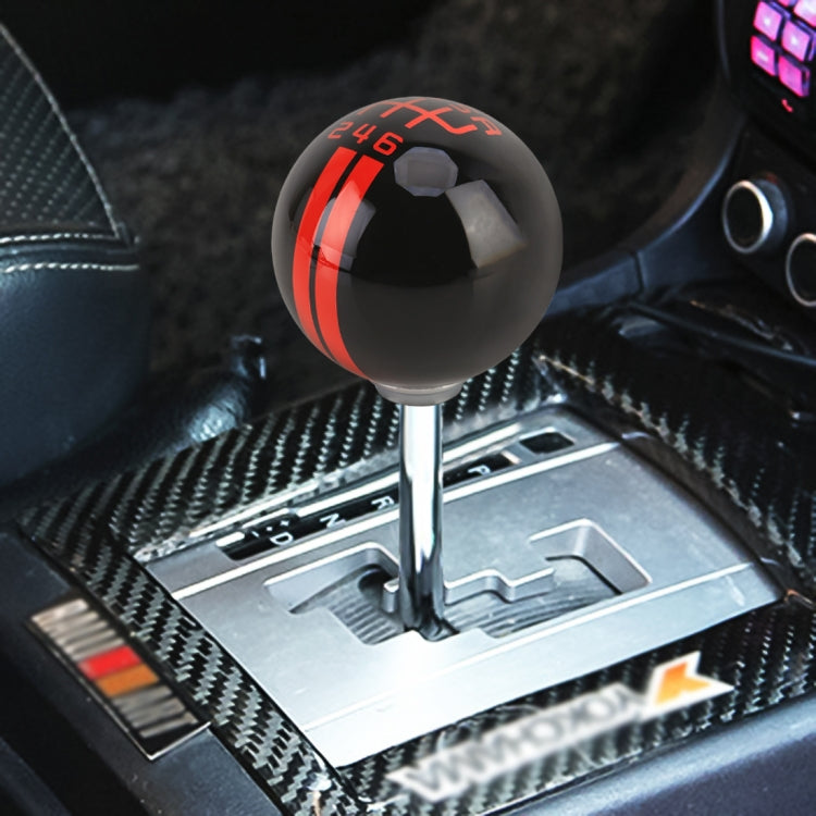 Black ball-style gear shift knob with red stripe and 246 marking