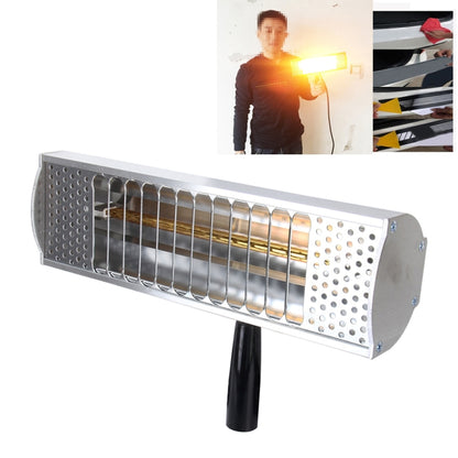 Handheld infrared heat lamp with metal reflector housing and glowing heating element
