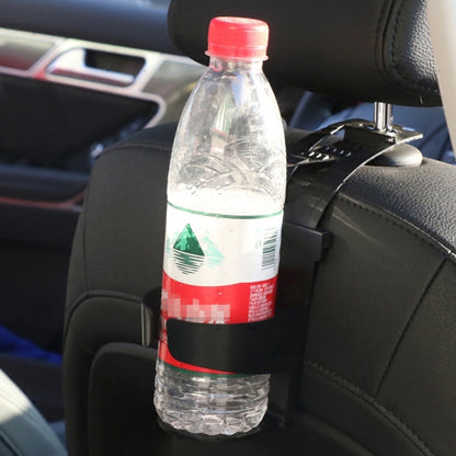 Car seatback hanging drink holder holding a clear water bottle on a car seat