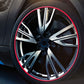 Car wheel with red shining rim trim strip around the tire edge