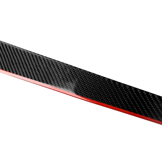 Close-up of carbon fiber-look decal strip with thin red edge line