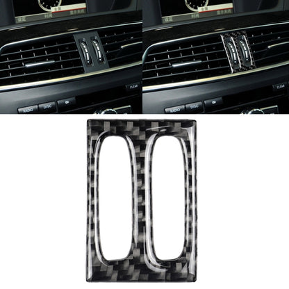 Carbon fiber air outlet trim insert with two vertical oval openings, glossy black weave.