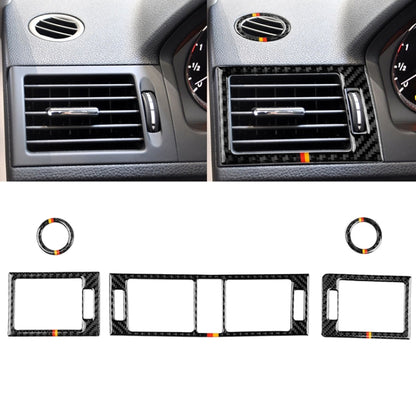 Carbon fiber air outlet panel set with German flag stripes, installed on dashboard vents