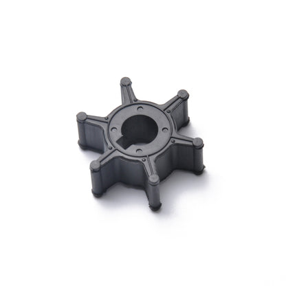 Outboard water pump impeller, black plastic housing with central bore and blades