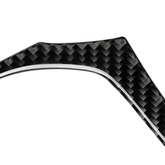 Black carbon-fiber steering wheel trim strip with glossy woven texture