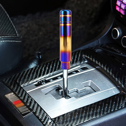 Universal flame-style gear shift knob with iridescent blue-gold cylinder and silver lever base