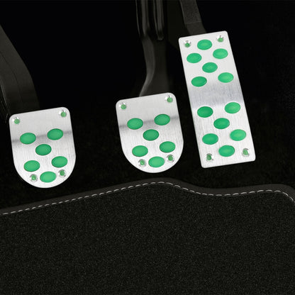 Car pedal cover set with three metal pads and green luminous dot inserts