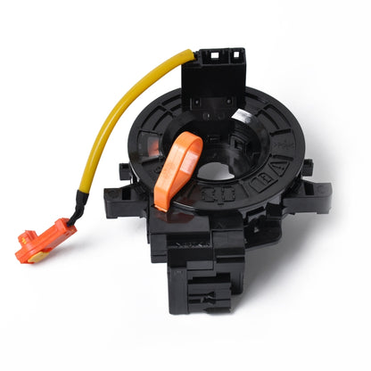 Clock spring spiral cable contact assembly with yellow and orange wiring and black housing