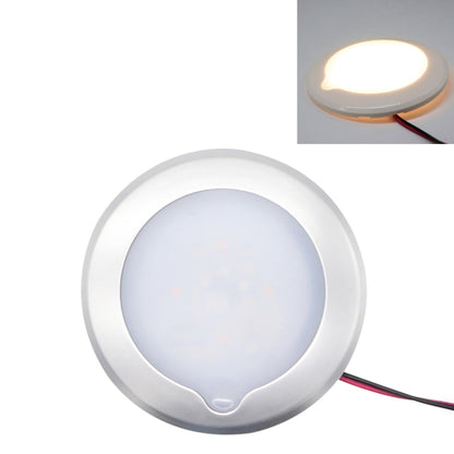 White round LED dome ceiling light with glowing center and attached red/black wires
