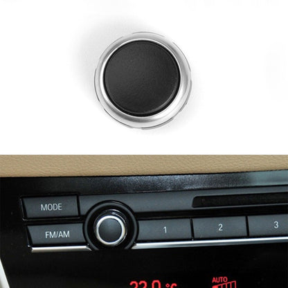 Round car radio volume knob with black center and chrome silver ring