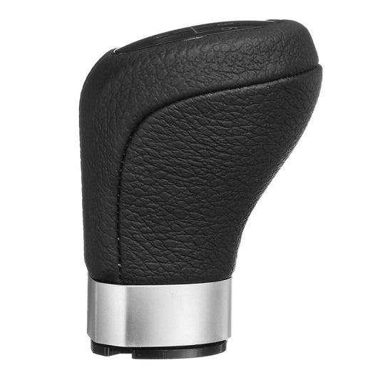Black leather-look gear shift knob with textured grip and silver base