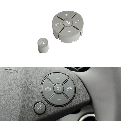 Grey steering wheel switch button panel with plus/minus and small thumb button