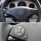 Steering wheel switch button panel with OK ring and arrow icons on left side
