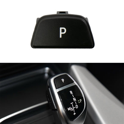 Car gear lever auto parking button cap with white “P” icon, black bezel