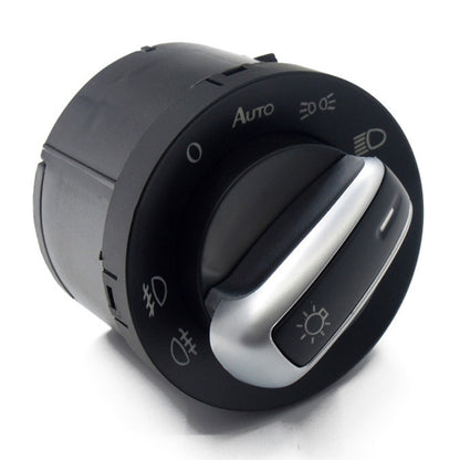 Black auto headlight and fog light switch knob with silver trim and control icons