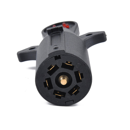 Trailer wiring signal tester round connector face with gold pins in black housing