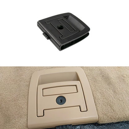 Black trunk handle cover with circular lock hole and rectangular pull