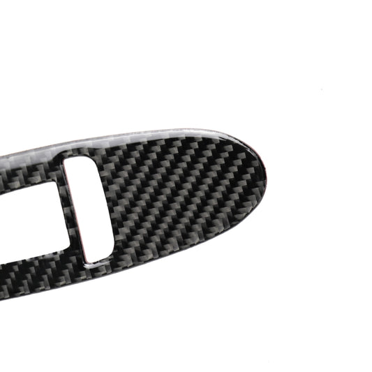 Carbon fiber-look trim strip with rectangular openings for window switch controls