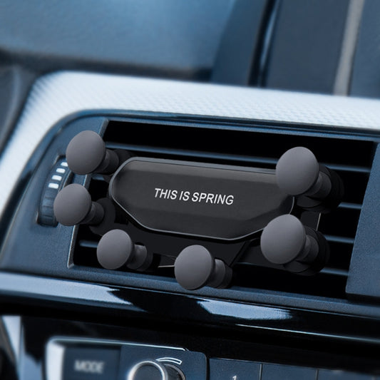 Black six-claw gravity car air outlet phone holder with six rubber contact pads