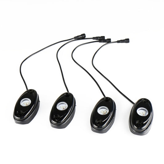 Four oval RGB LED light pods with power leads for car underglow