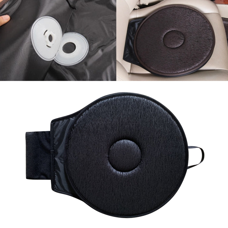 Car seat rotation cushion with round black pad and center circle, shown with straps