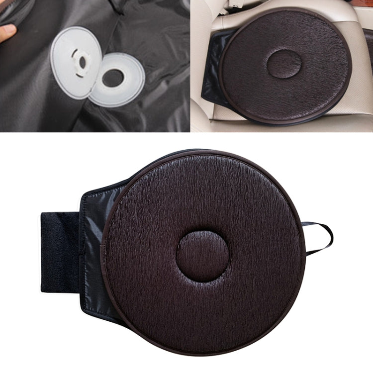 Car seat rotation cushion with dark brown circular pad, center button, and strap loop