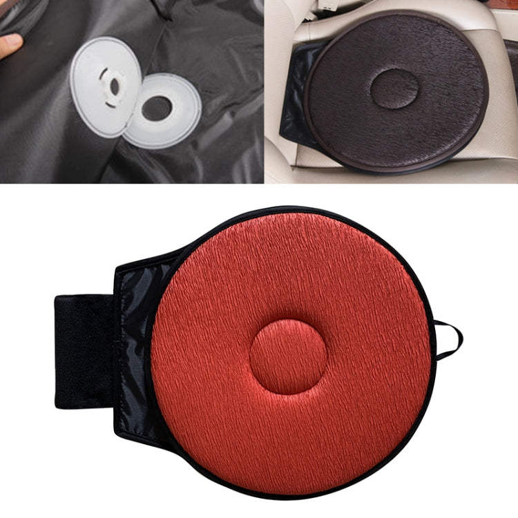 Car seat rotation cushion with vermilion-red circular pad, center button, and black backing