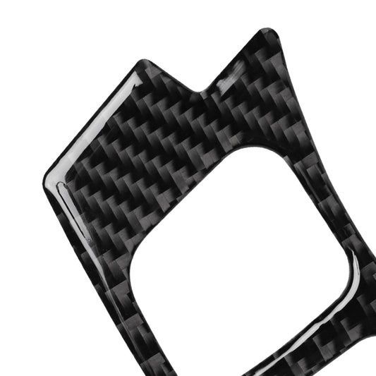 Close-up of carbon fiber steering wheel button sticker backing with white cutout