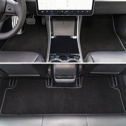 Black velvet car floor mat set with center console and front footwell coverage.