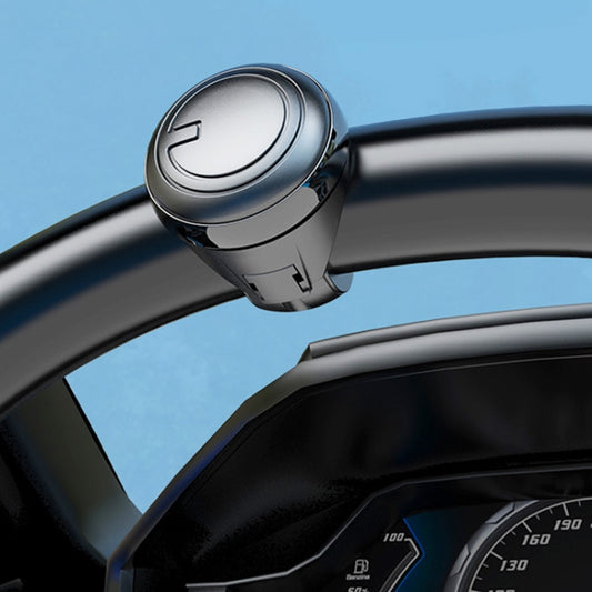 Black steering wheel spinner knob with silver-toned top cap and grip latch