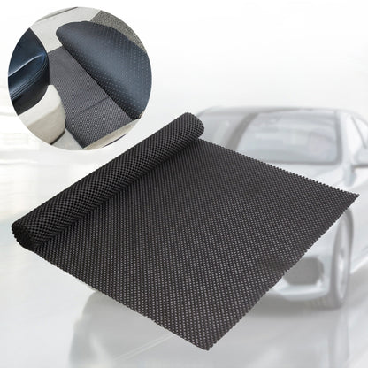 Black textured PVC anti-slip car mat, folded sheet with fine grid pattern.
