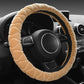 Beige plush steering wheel cover with ribbed texture, anti-slip grip.
