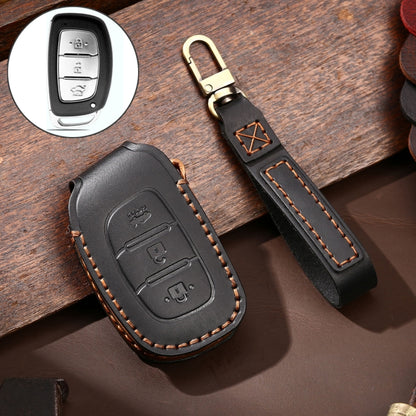 Black leather key fob protective cover with cutout buttons and stitched edges