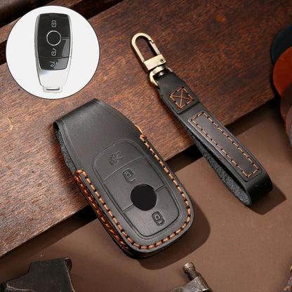 Brown leather key protective cover case with stitched edge and key fob button cutout