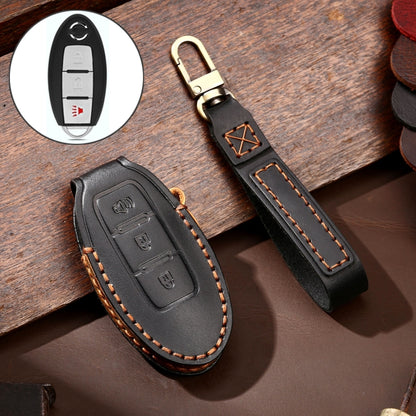 Black leather car key protective cover with stitched edges and metal key ring loop