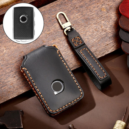Black leather key fob cover with metal ring and round button cutout