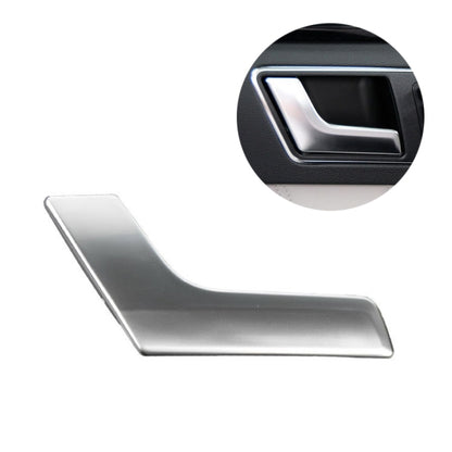 Matte inner door handle trim with silver chrome surround, close-up view