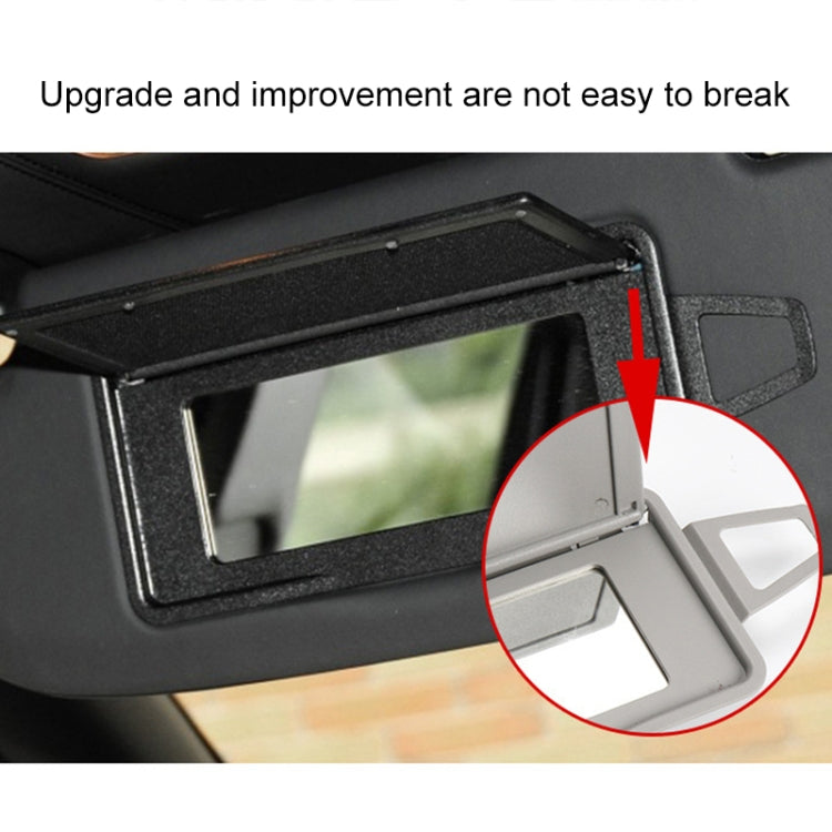 Right sun visor makeup mirror hinge and latch mechanism close-up