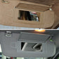 Car sun visor makeup mirror installed on beige and grey visor panels