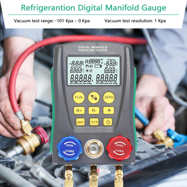 Digital manifold pressure tester held near car engine hoses with blue and red valve caps