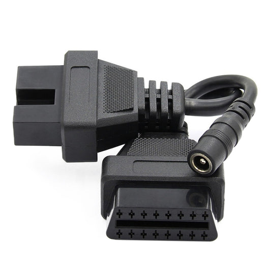 OBD2 adapter cable close-up of 12-pin and 16-pin connectors with audio-style round plug