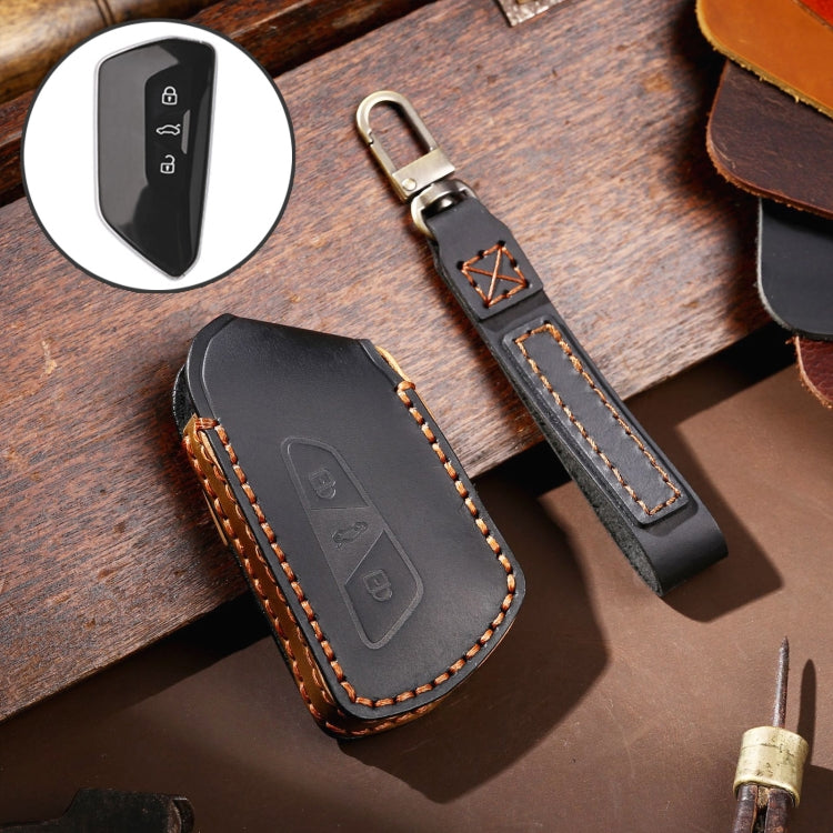 Black cowhide leather key fob protective cover with stitched trim and logo panel